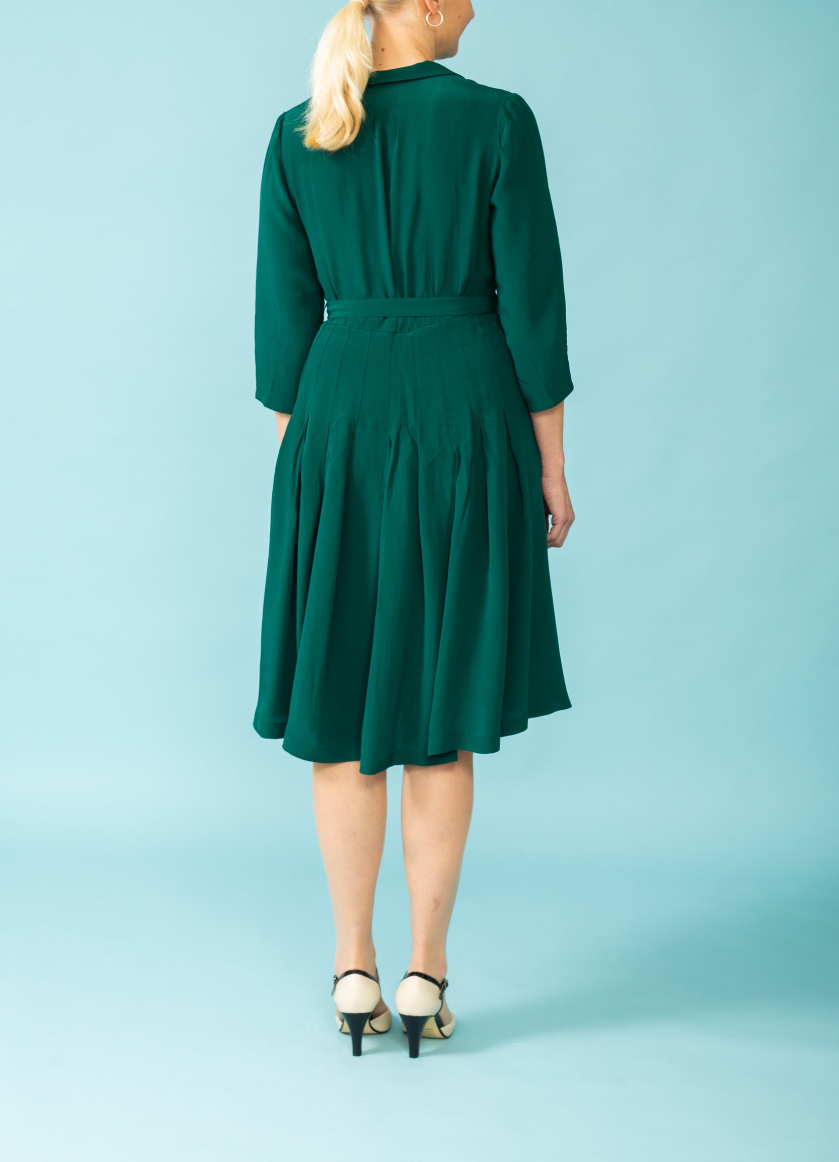 Bottle green dress with three quarter sleeves Buy online